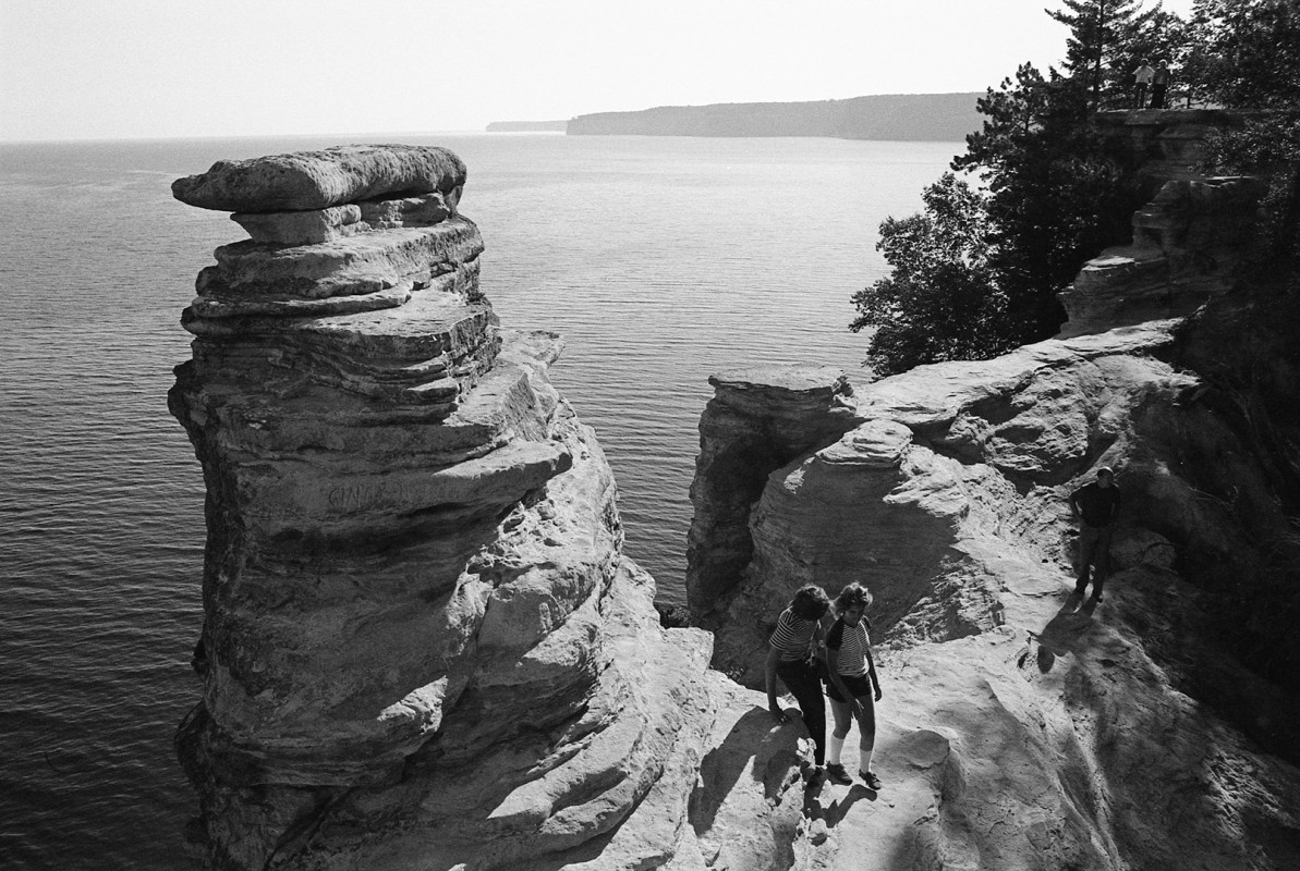 Hikers navigate  Miners' Castle, Lake Superior Pictured Rocks; 1976.