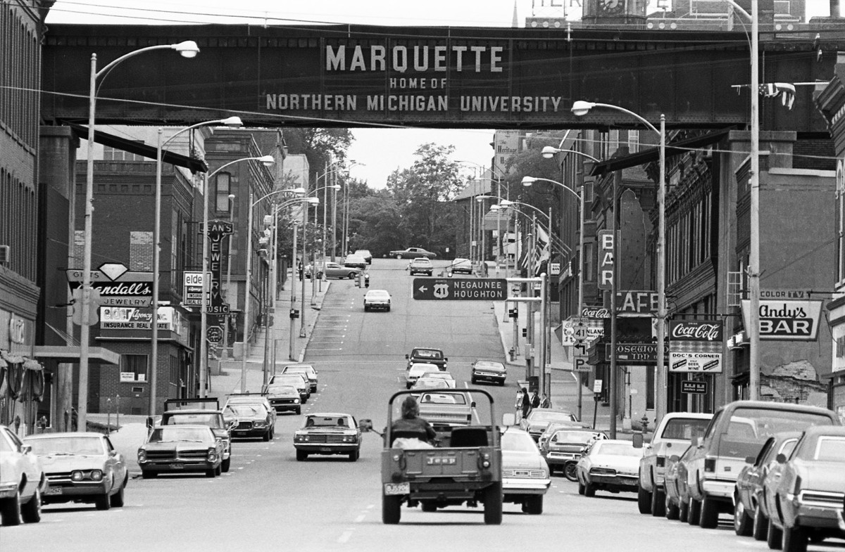 Downtown seems busy, Marquette; 1976.Guide to Michigan,
