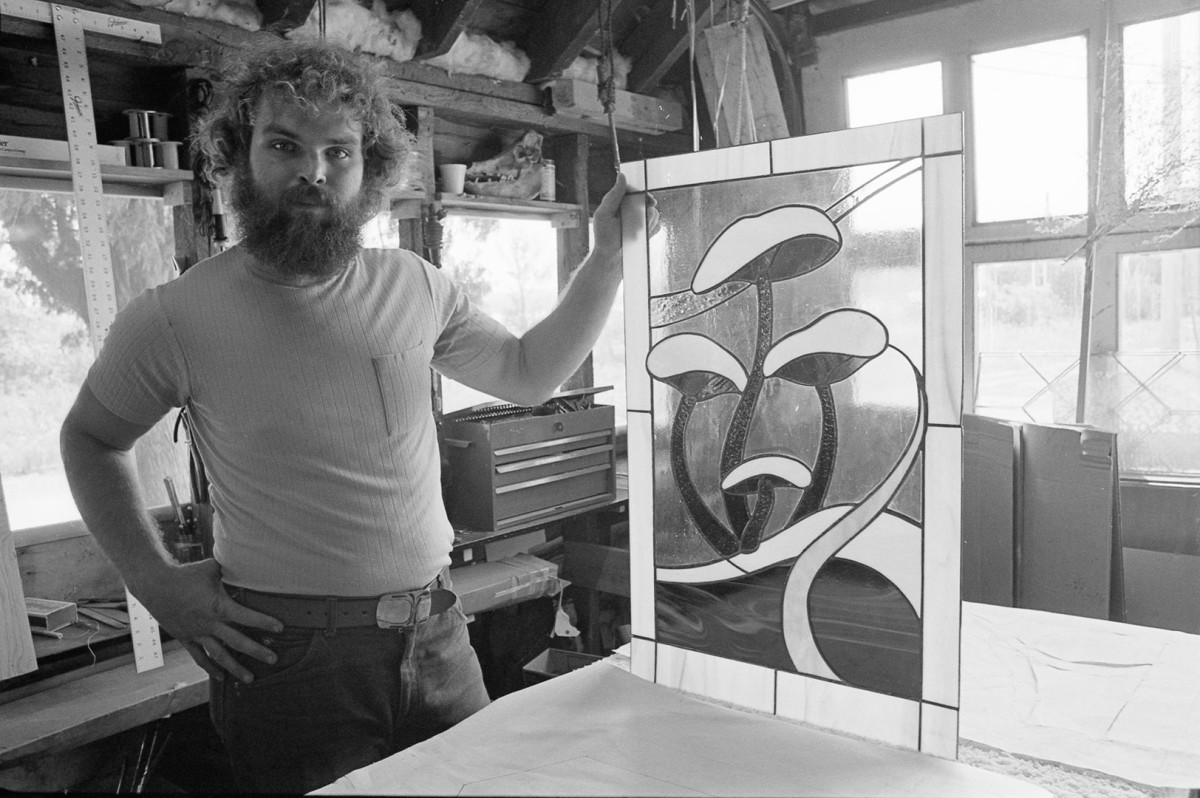 Tom Woodruff owns a glass studio, Suttons Bay; 1976.Guide to Michigan,
