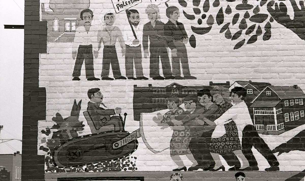 ACCESS Building murals depicting local struggles over urban removal; 1980.