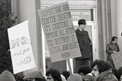 Demonstrators march at Dearborn City Hall in support of ACCESS after funding cuts were threatened, 1977.Dearborn Police Chief John Connolly on the stairs.