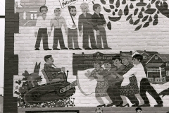 ACCESS Building murals depicting local struggles over urban removal; 1980.