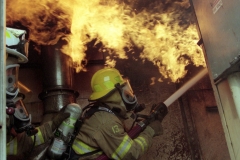 Firefighters practice in a simulator; 2001.