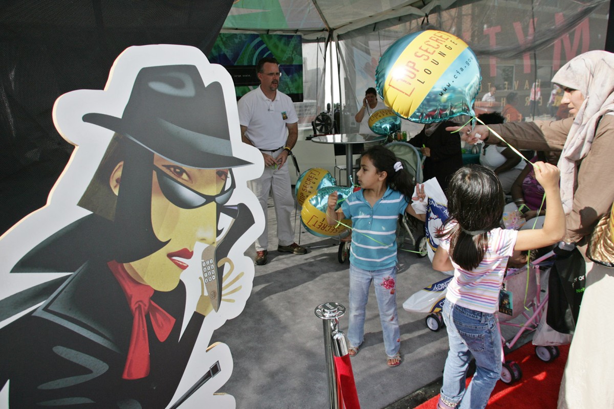 ArabInt09Fest55:      	An animated character lures visitors to the Central Intelligence Agency recruiting booth in 2009 at the Arab International Festival.