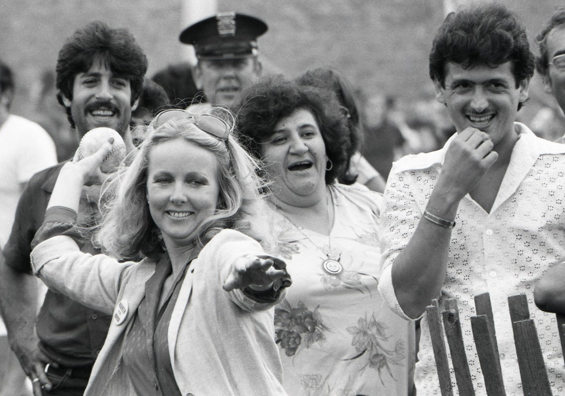Maureen Kean Doran throws out a softball to open the annual Southend Street Festival, 1981.