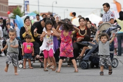 ArabInt11Fest080:	As the music begins Friday at the Arab International Festival a group of young kids begin to dance.