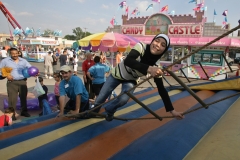 ArabInt2010Fest42:    	Fatima Abbas finds the ladder climb a challenge during the 15th Annual Arab International Festival Saturday.