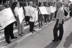 Demonstrators protest sales of racist sterotype Arab masks for sale at Lynches for Halloween; 1989. Ismael Ahmed.